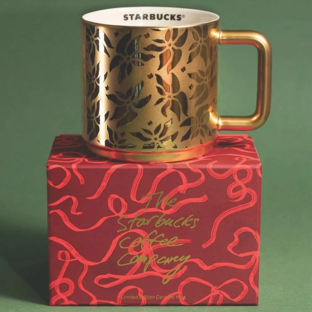 2025 Starbucks, gold poinsettia coffee cup. New with box.